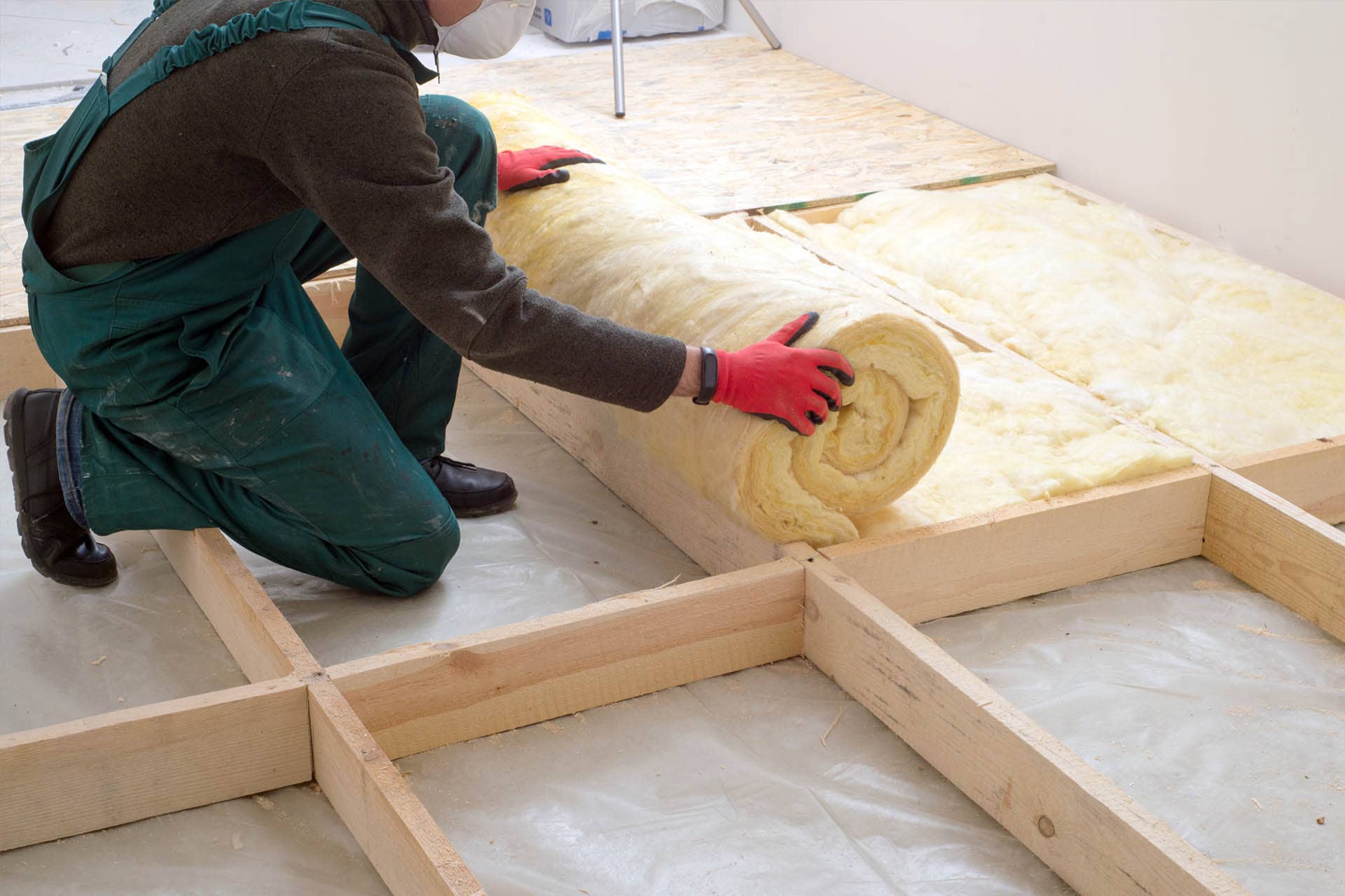 thermal-insulation-wool-rolls-on-floor-installation-building-materials